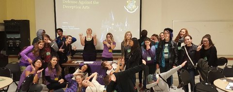 Payton Barnwell and the class she led at MIT, under a slide reading ‘Defense Against the Deceptive Arts’.