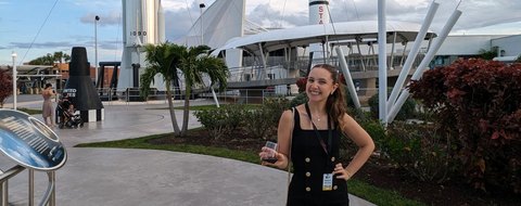 Payton Barnwell at the Kennedy Space Center rocket garden, VIP badge on.